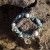 bracelet-tides-no-2-aguas-infinitas-collection-on-rock.jpg