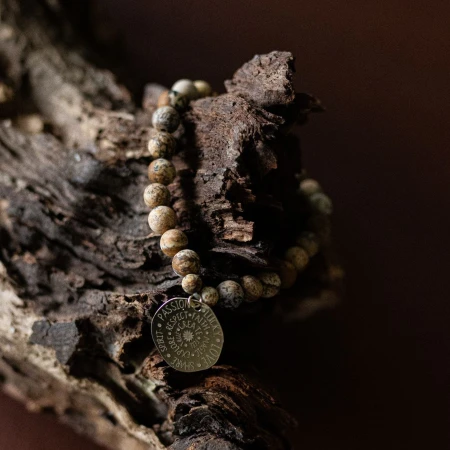 bracelet-in-the-embrace-of-mother-earth-on-wood.jpg