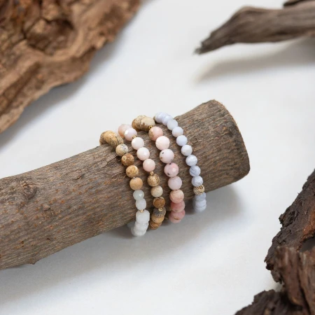 tierra-poderosa-bracelet-stack-on-wood.jpg